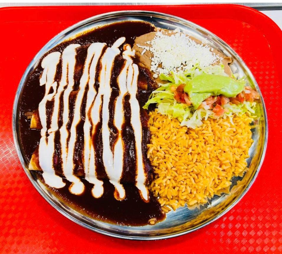 Enchiladas at Salsa and Sabor Kelowna BC - Corn tortillas filled with your choice of meat, topped with enchilada sauce and melted cheese