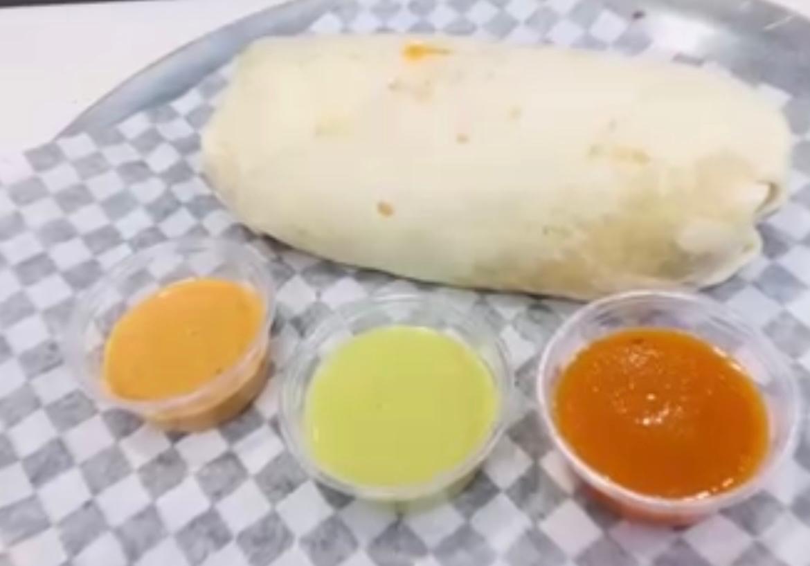 Burritos at Salsa and Sabor - Large flour tortilla filled with seasoned meat, rice, beans, and fresh toppings