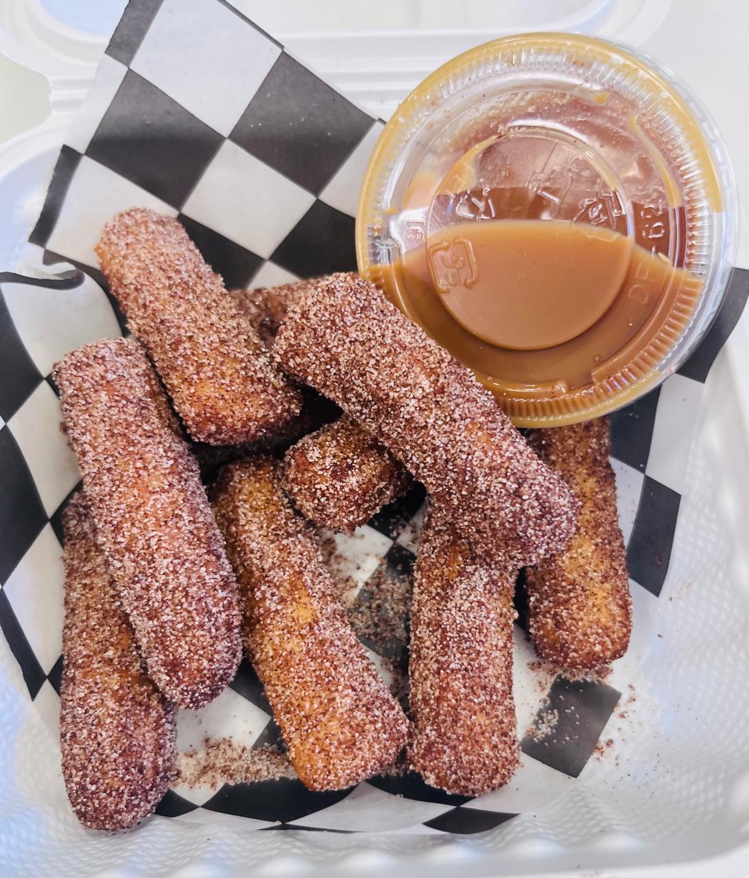 Churros with Dulce de Leche at Salsa and Sabor - Crispy fried churros dusted with cinnamon sugar and served with dulce de leche